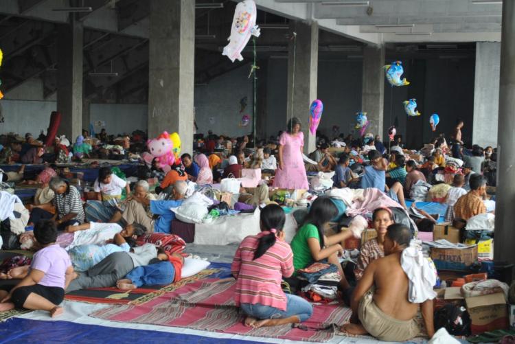 Evacuees from Mount Merapi volcano wait in boredom for emergency teams to give them the green light to return home.