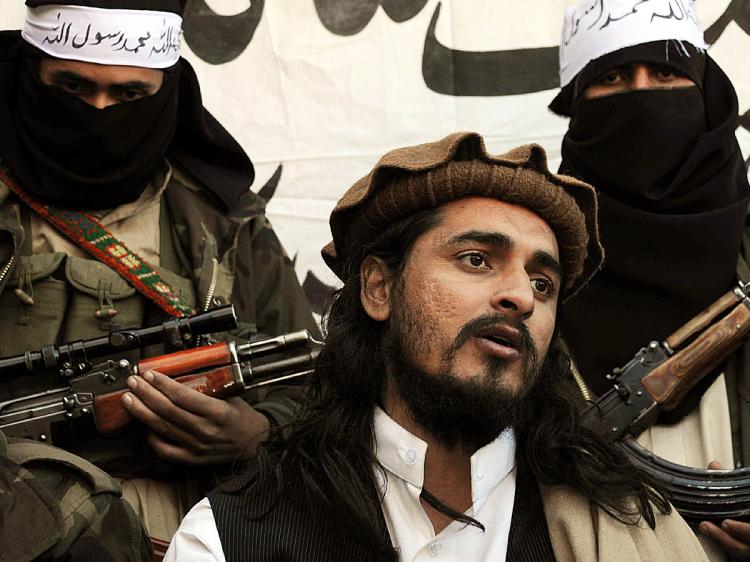 In this photograph taken on November 26, 2008, Pakistani Taliban commander Hakimullah Mehsud speaks to a group of media representatives in the Mamouzai area of Orakzai Agency. (A Majeed/AFP/Getty Images)