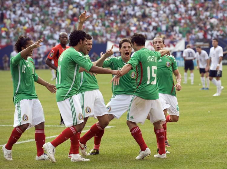 FIESTA! Mexican players celebrate after Jose Antonio Castro #15 scored his team's fourth goal. (Don Emmert/AFP/Getty Images)