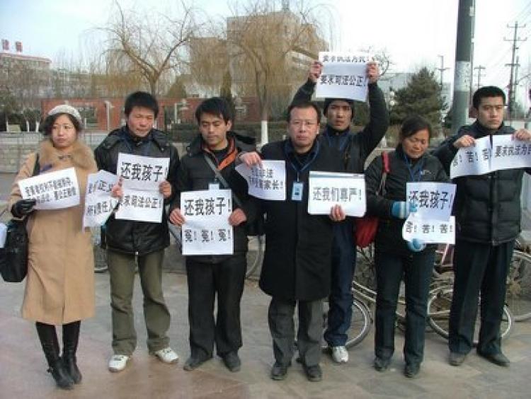 Parents of melamine-tainted milk powder victims banded together to safeguard the rights of Chinese babies.  (Rights Movement)