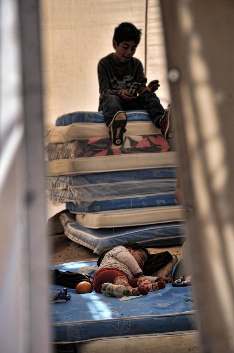 Relatives of trapped miners sleep in a shelter outside the San Esteban gold and copper mine, near the city of Copiapo.  (Martin Bernett/Getty Images)