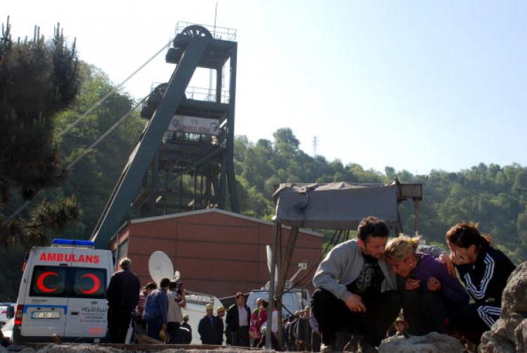 Relatives of miners who are trapped underground after an explosion in a coal mine wait for news near the mine in Turkey's Black Sea city of Zonguldak, on May 18, 2010. (STR/AFP/Getty Images)