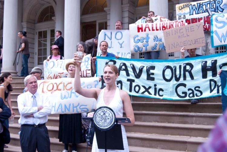 Monica Hunken from SWiM, and rally organizer, protests against fracking outside City Hall Thursday. (Joshua Philipp/The Epoch Times)