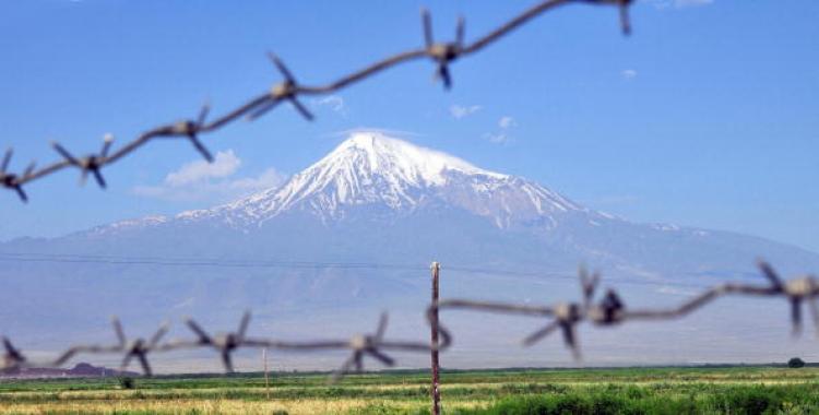 Mount Ararat is seen through a barbed-wire fence from the Armenian town Artashat on July 11, 2009. Archeologists from Noah's Ark Ministries say a boat they have found on Mount Ararat has a '99 percent' chance of being Noah's Ark of biblical fame. (Karen Minasyan/AFP/Getty Images)