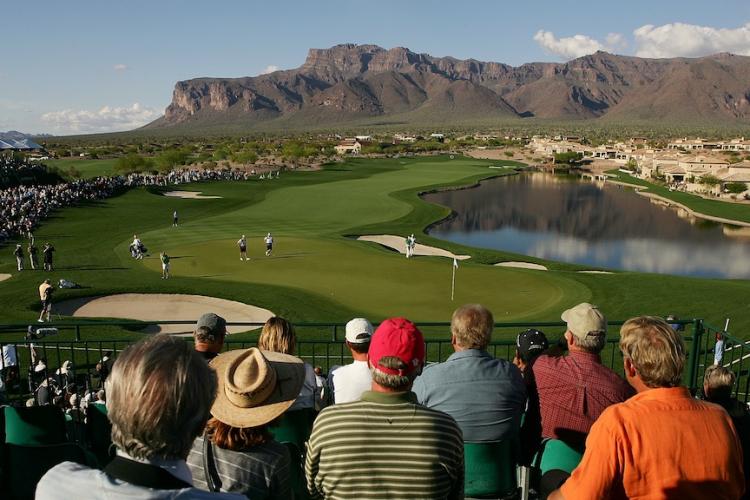 The Superstition Mountain mountain range is seen in the distance as fans watch a golf tournament in Superstition Mountain, Arizona.  (Scott Halleran/Getty Images)