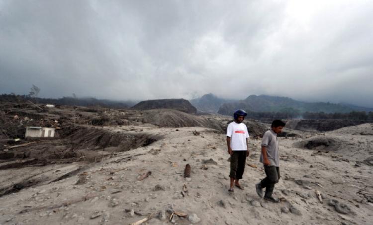 Former residents walk amongst the remains of the village of Kali Adem in Sleman on October 28, 2010 after the area was devastated by the eruption of Mount Merapi volcano on October 26.  (Adek Berry/AFP/Getty Images)