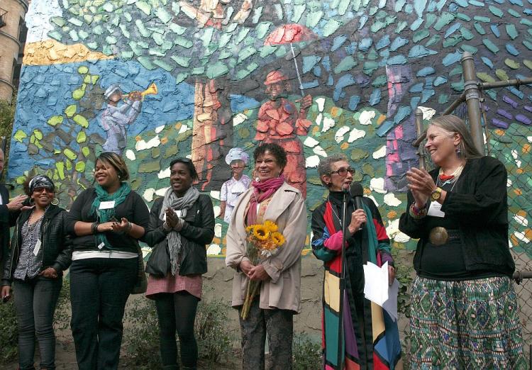 The restoration of a 1986 Harlem mural was executed by (L to R) Jessica Guzman, Ariel Mercado, Alexandra Unthank, Maria Dominguez, Director Janet Braun-Reinitz, and Rochelle Shicoff. (Tim McDevitt/The Epoch Times)