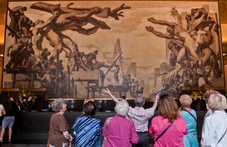 Restored murals in Rockefeller Plaza are unveiled on Thursday. The Jose Sert and Frank Brangwyn murals total more than 16,000 square feet of canvas located on the walls, staircases, mezzanine and ceiling of 30 Rockefeller Plaza and were commissioned by John D. Rockefeller and John D. Rockefeller Jr. in 1933. They are meant have a unifying theme, 'New Frontiers, encompassing all aspects of American society: labor, science, communication, culture, spirituality, travel and history,' according to a release. (Aloysio Santos/The Epoch Times)