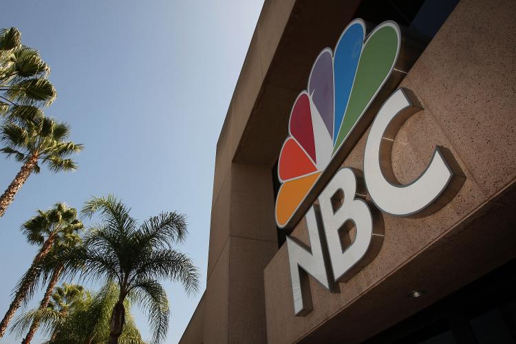 The NBC peacock logo hangs on the NBC studios building last year in Burbank, California. Rumors are swirling that NBC Universal was put up for sale by parent General Electric Co. (David McNew/Getty Images )