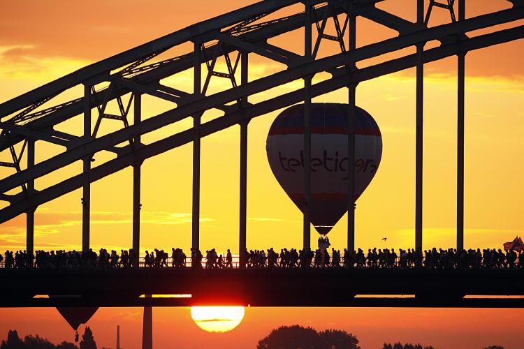 Participants cross the Waal river near Nijmegen, Netherlands, on July 21, 2009 at the start of the 93rd Nijmegen four-day walk. (Vincent Jannink/AFP/Getty Images )