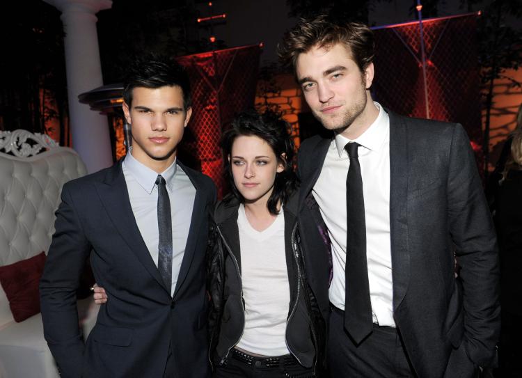 Actors Taylor Lautner, Kristen Stewart and Robert Pattinson arrive at the afterparty for the premiere of Summit Entertainment's 'The Twilight Saga: New Moon' at the Hammer Museum on November 16, 2009 in Los Angeles, California.  (Kevin Winter/Getty Images)