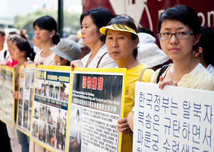 New Yorkers gather to appeal for an end to deportations of Falun Gong practitioners from South Korea to China. They stand outside the Consulate General of the Republic of Korea in Midtown Manhattan on Wednesday. (Amal Chen/The Epoch Times)
