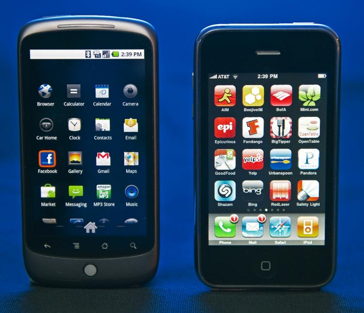 The Google Nexus One(L) smartphone with provider service from T-Mobile, and the Apple iPhone(R), with provider service from AT&T, sit side-by-side. Apple has filed a lawsuit against smartphone maker HTC for alleged patent infringement. (Paul J. Richards/AFP/Getty Images)