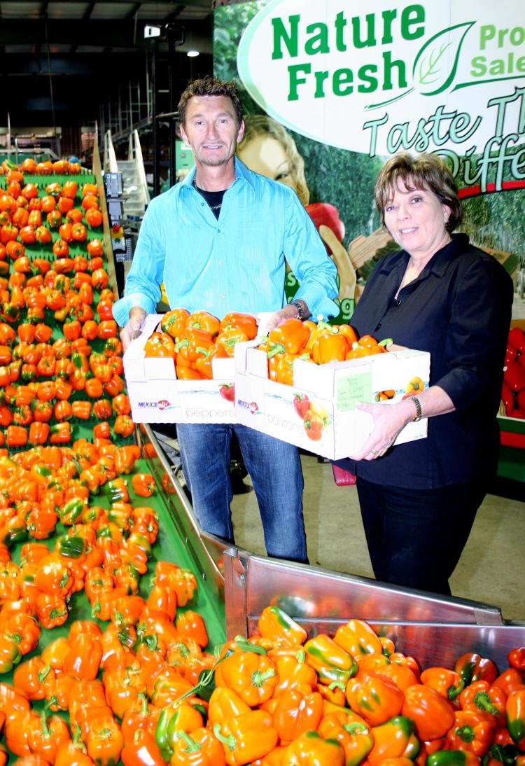Peter Quiring, founder and president of Nature Fresh Farms, and Joanne Santucci, executive director of Hamilton Food Share, have teamed up to distribute half a million pounds of bell peppers to food banks in Ontario.  (Nature Fresh Farms)