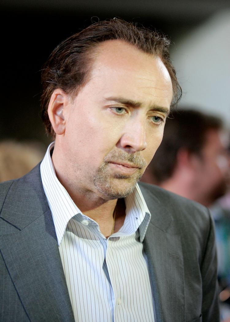 In this file photo, actor Nicolas Cage arrives at the 'Bad Lieutenant: Port Of Call New Orleans' screening held in Toronto, Canada. Cage, one of Hollywood's foremost actors, is reported to be deep in financial trouble. (Malcolm Taylor/Getty Images)