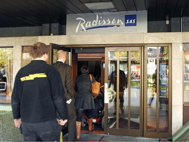 Guests enter the SAS Radisson 'Hotel Norge' in Bergen, Norway.  (Marit Hommedal/AFP/Getty Images)