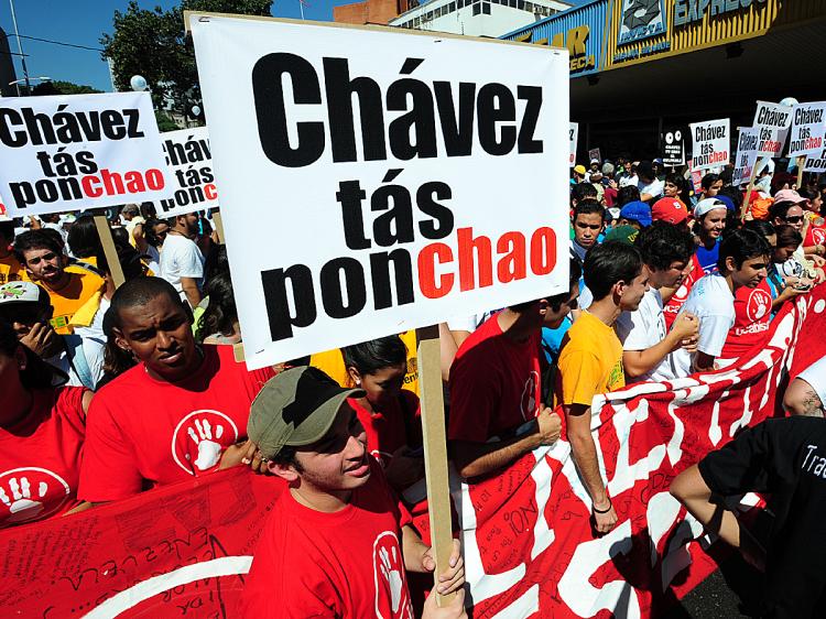Opponents of Venezuelan President Hugo Chavez rally to commemorate the 52nd anniversary of the overthrowing of dictator general Marcos Perez Jimenez, in Caracas, January 23, 2010. (Juan Camacho/AFP/Getty Images)