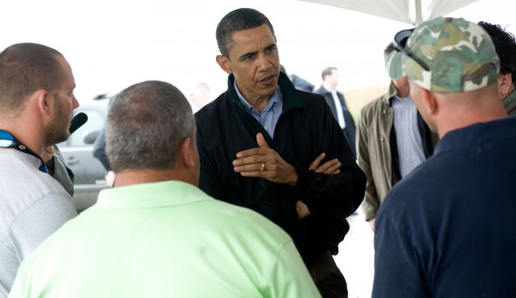 U.S. President Barack Obama speaks with local fishermen about how they are affected by the BP oil spill after meeting with officials at Coast Guard Station Venice in Venice, LA., May 2.  (Saul Loeb/Getty Images)