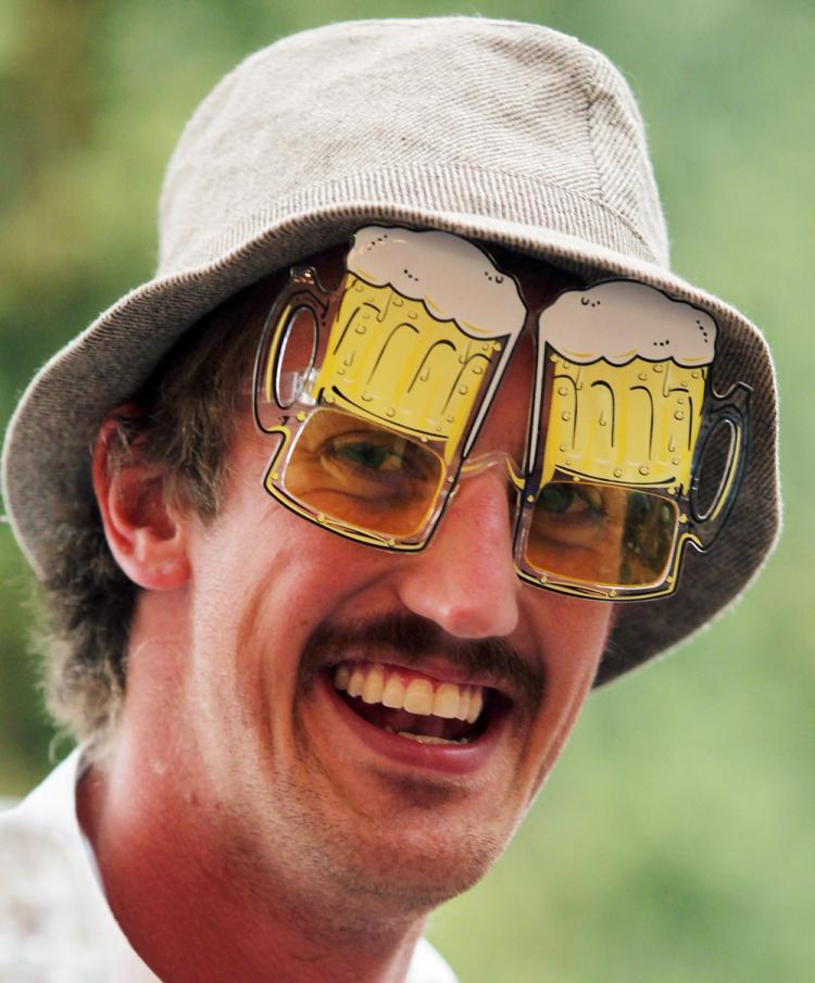 A visitor smiles as he wears beer glasses during the opening day of the Oktoberfest on Sept. 18 in Munich, Germany. 2010 marks the 200th anniversary of Oktoberfest. (Alexandra Beier/Getty Images)