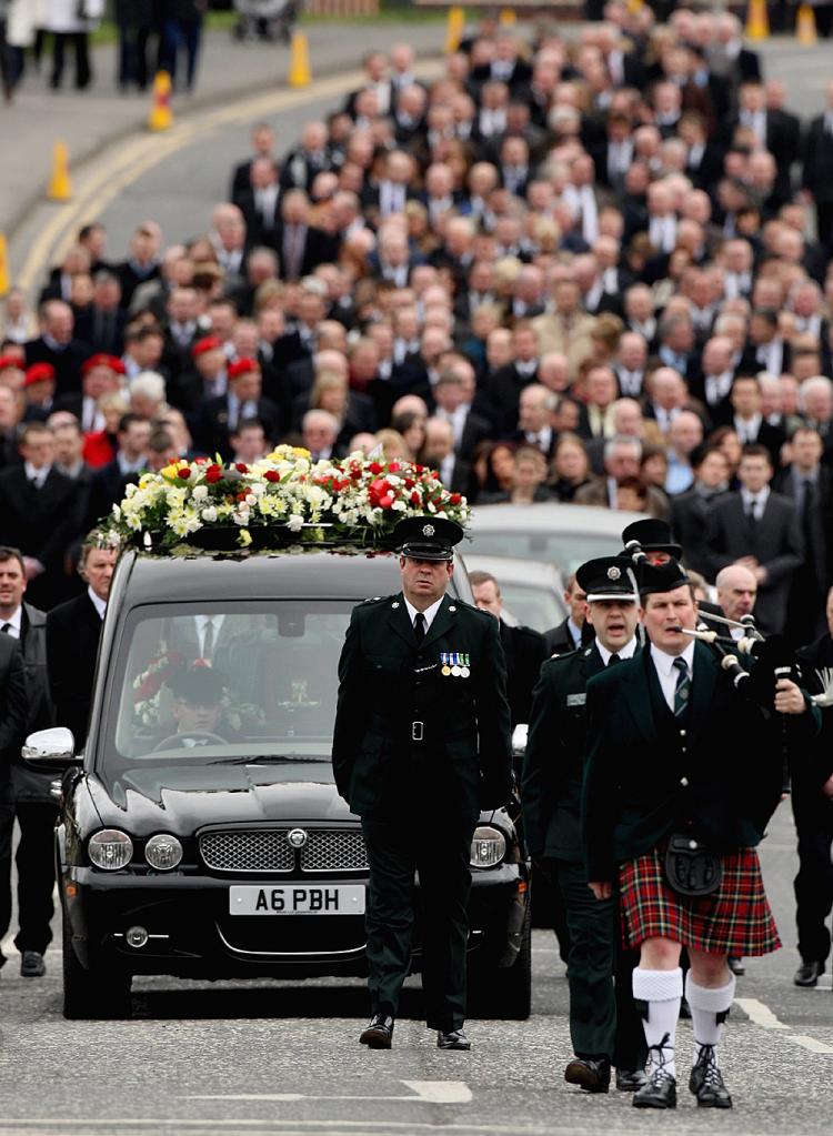 The funeral procession of Constable Stephen Carroll arrives at St Therese's chapel in Banbridge on March 13, 2009 in Northern Ireland. The killings of two British Soldiers and Constable Stephen Carroll by dissident republicans this week is thought by many (Jeff J. Mitchell/Getty Images)
