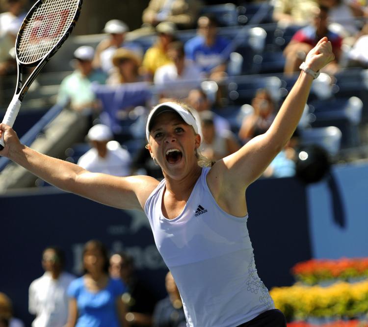 EMOTIONAL WIN: Melanie Oudin celebrates after defeating fourth-seeded Elena Dementieva of Russia on Thursday. (TIMOTHY A. CLARY/AFP/Getty Images)