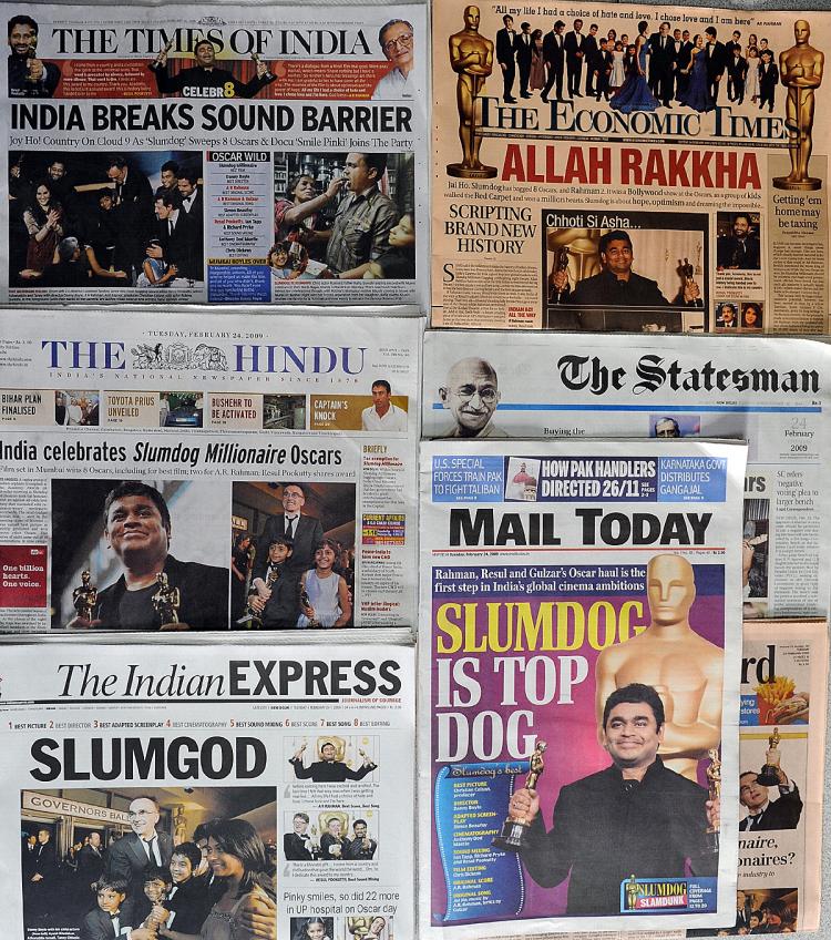 Indian newspaper front pages feature the Oscar success of the film 'Slumdog Millionaire' in New Delhi on February 23, 2009.   (Prakash Singh/AFP/Getty Images)