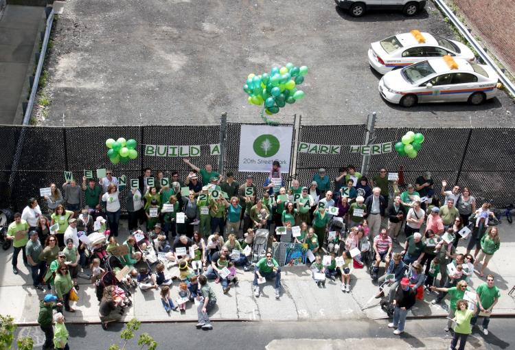 CHELSEA GREENS: Residents of Chelsea posed for a photo in front of a lot on West 20th Street on Sunday. They hope the city will use the space to create a new park.  (Ivan Pentchoukov/The Epoch Times)