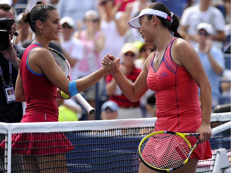 Flavia Pennetta (L) shakes hands after defeating Shuai Peng of China during their women's match at the US open. (Timothy A. Clary/AFP/Getty Images)