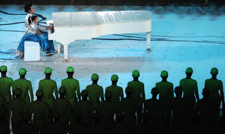 Chinese young pianist Lang Lang and five-year-old Li Muzi perform during the opening ceremony of the 2008 Beijing Olympic Games in Beijing on August 8, 2008. (Filipo Monteforte/AFP/Getty Images)