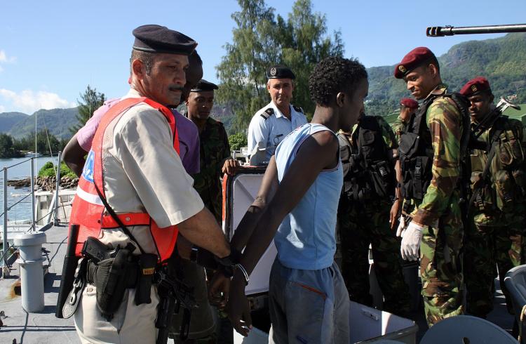 A Somali pirates is arrested March 31, in the Port Victoria. Crew of a Libyan owned cargo vessel hijacked by Somali pirates managed to regain control of their vessel when rival pirate gangs engaged in a shootout.   (Srdjana janosevic/Getty Images)