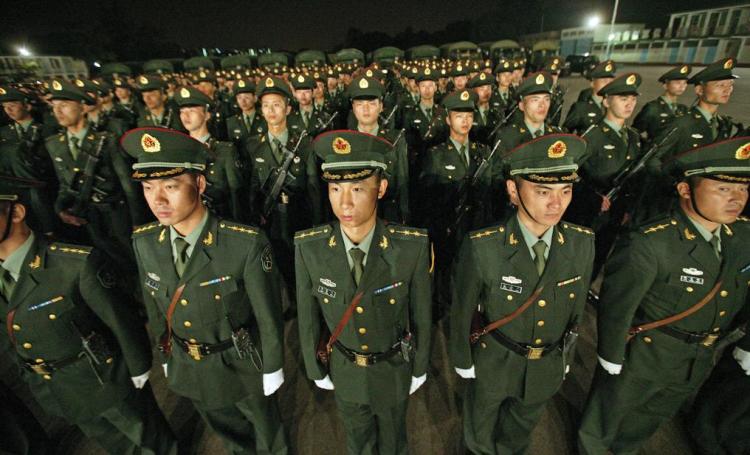 FRIEND OR FOE? Chinese People's Liberation Army (PLA) troops line up in a parade ground in Hong Kong's New Territories during the city's annual rotation of military personnel, or 'Changing of the Guard' as it is better known, in Hong Kong on Nov. 25, 2008 (Alex Hofford/AFP/Getty Images)
