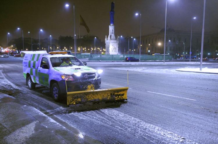 A snow plough clears a snow covered street in central Madrid on December 21, 2009. Snowfall disrupted road and rail transportation in Spain and forced the cancellation of dozens of flights as a cold spell continued to grip much of Europe, officials said.  (Dominique Faget/AFP/Getty Images)