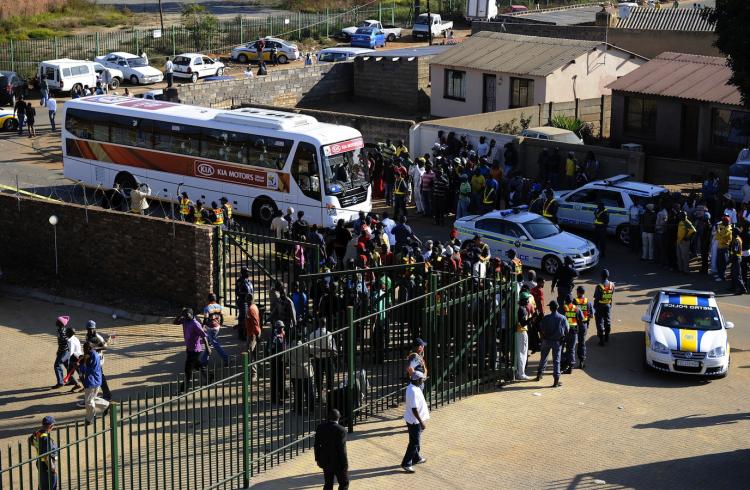 The bus carrying Nigeria's football team arrives at Makhulong Stadium prior to their friendly football match against North Korea on June 6 in South Africa. A stampede of fans left one policeman seriously injured and 14 fans with minor injuries.  (Stephane De Sakutin/Getty Images)