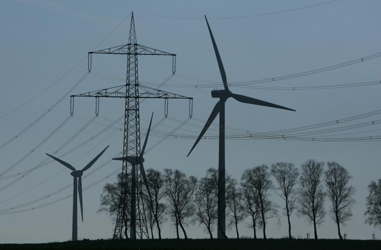 In this file photo, wind turbines generating electricity are silhouetted together. The U.S. electric grid system has been reported to have been heavily compromised by hackers from China and other countries. (Sean Gallup/Getty Images)