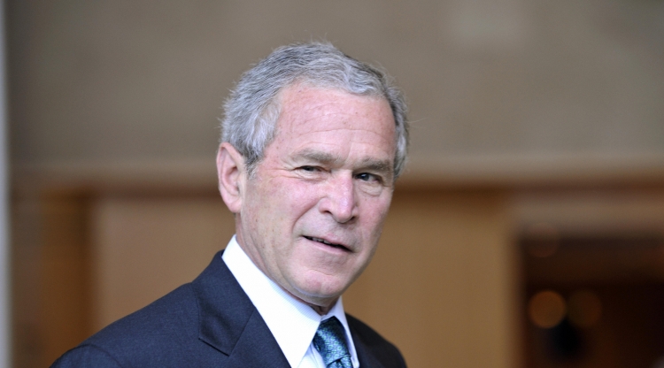 US President George W.Bush jokes as he arrives for the G8 Summit at the Windsor Hotel Toya in Toyako on July 7, 2008. Leaders of the Group of Eight industrialised nations Monday launched their annual summit in Japan with surging oil and food prices and cl (Gerard Cerles/AFP/Getty Images)