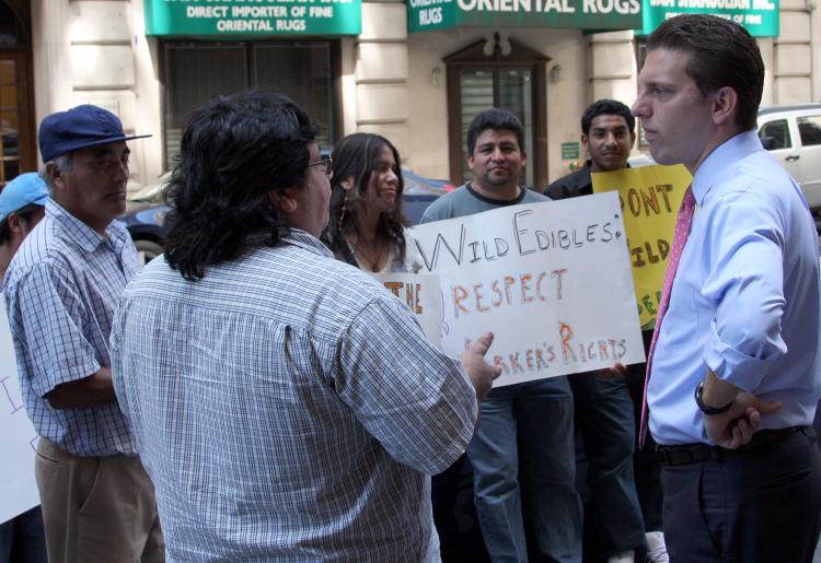 STANDING FOR THEIR RIGHTS: Councilman Eric Gioia visited a protest at the Artisanal Bistro where former Wild Edibles workers now employed at the restaurant were protesting.  (Can Sun/Epoch Times)