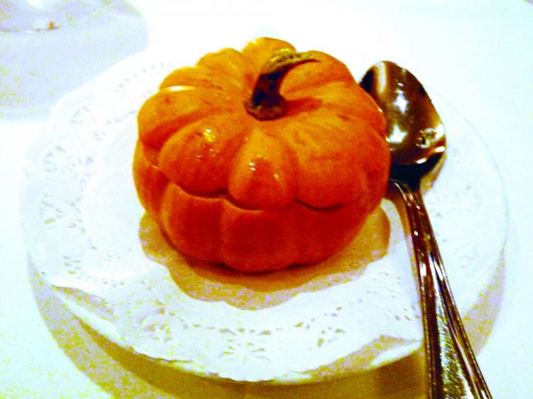 The seasonal pumpkin soup with honeydew melon topped with Amaretto cookies and served in a small round pumpkin (Nadia Ghattas/The Epoch Times)