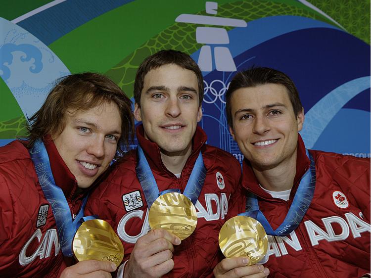 Canada skaters (L to R) Mathieu Giroux, Denny Morrisson and Lucas Makowsky won gold in the men's team pursuit speed skating event at the XXI Winter Olympics in Vancouver. (David Hecker/AFP/Getty Images)