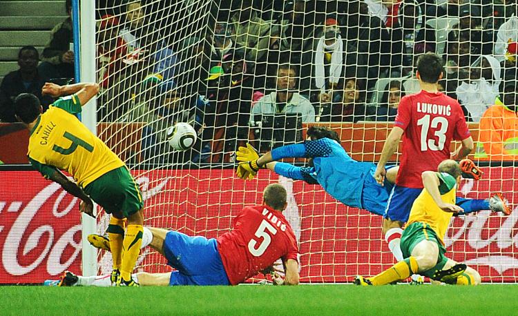 Tim Cahill (L) scores the first goal during the Group D first round Australia vs Serbia World Cup match. (Christophe Simon/AFP/Getty Images)