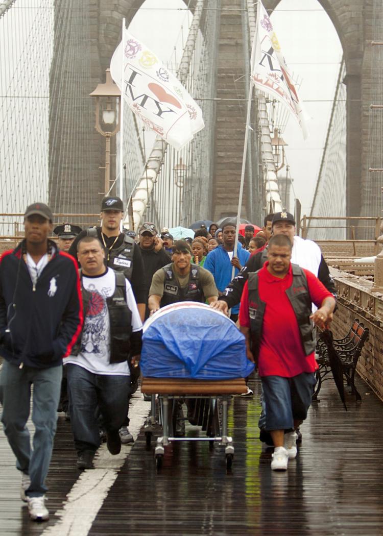 Demonstrators against gun violence walked across the Brooklyn Bridge on Wednesday in the 'Tsumani of Peace' march.  (Henry Lam/The Epoch Times)
