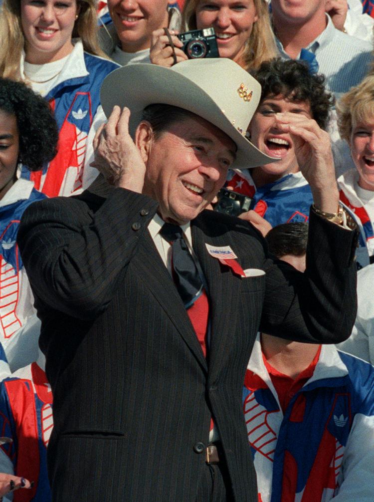 THE GIPPER: President Ronald Reagan tries on an Olympic cowboy hat on the South Lawn of the White House in Oct. 1988 during a ceremony honoring the U.S. Olympic team.  (Mike Sargent/Getty Images )