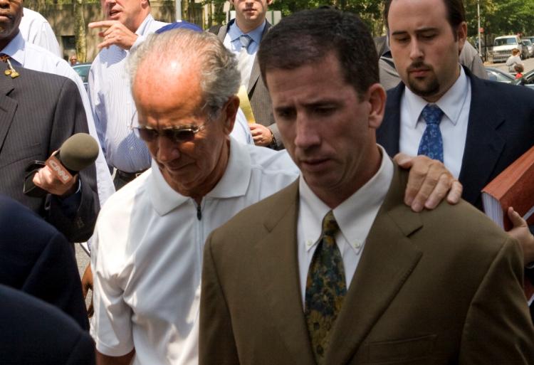 FOUL PLAY: Gerry Donaghy comforts his son, ex-NBA Referee Tim Donaghy, as they leave Brooklyn Federal Courthouse on July 29. Tim Donaghy was sentenced to 15 months of prison for betting on games he refereed.  (Mimi Li/The Epoch Times)