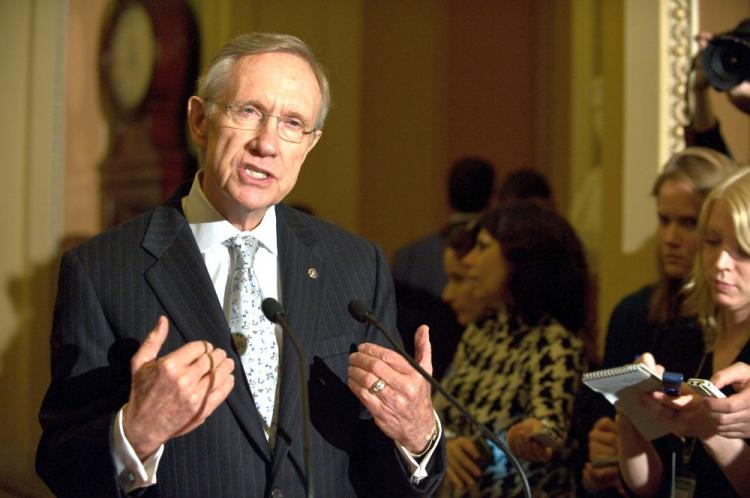 Senate Majority Leader Harry Reid (L) of Nevada speaks to the press on Nov 21. The Senate began debate on health care reform on Monday.  (Nicholas Kamm/AFP/Getty Images)