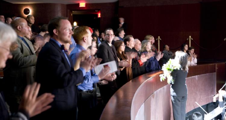 A full-house audience claps at the end of a Divine Performing Arts show at Ford Community & Performing Arts Center on December 30.  (Renee Luo/The Epoch Times)