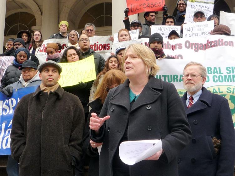Irene Baldwin, executive director at the Association for Neighborhoods and Housing, stands with State legislators and community members to support a new bill that will tighten rent regulations. (Christine Lin/The Epoch Times)