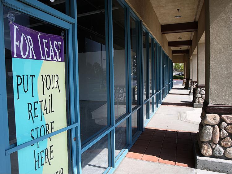 Retail space for lease in a strip mall is advertised in Fontana, California. (David McNew/Getty Images)