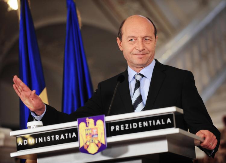 Romanian President Traian Basescu gestures during a press conference on Dec. 15, 2008. He recently declared that Romania is less worried about the financial crisis. (Daniel Mihailescu/AFP/Getty Images)