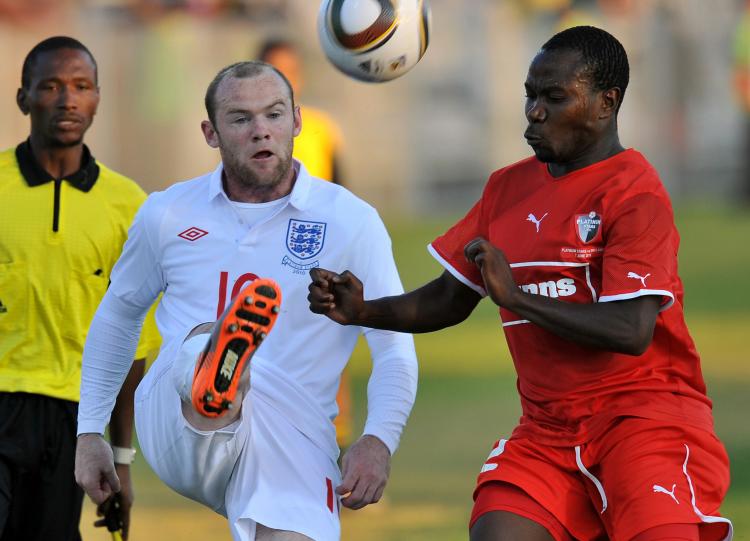 Wayne Rooney (L) in action against Platinum Stars on Monday. (Jung Yeon-Je/AFP/Getty Images)