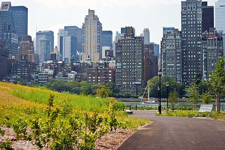 NEW PARK: Southpoint Park on Roosevelt Island offers a view of midtown Manhattan as sail boats glide down the East River. (Ivan Pentchoukov/The Epoch Times)