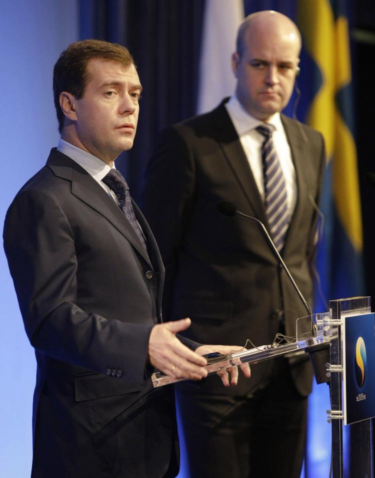 Russian President Dmitry Medvedev (L) delivers a speech at the EU-Russia summit with Swedish Prime Minister Fredrik Reinfeldt (R) in Stockholm on Nov. 18, 2009.  (Vladimir Rodionov/AFP/Getty Images)